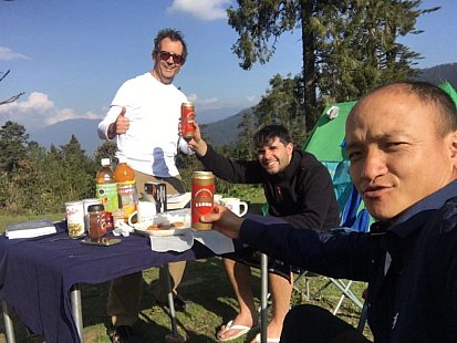 Renato, Andre and their guide Dawa enjoying the refreshments on the trek